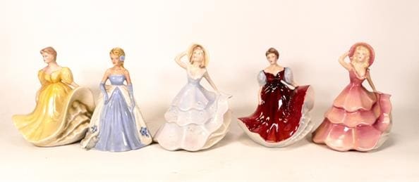 A collection of Wade Pottery ceramic lady figures