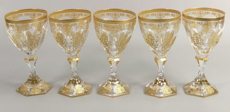 Lot 34 was a set of De Lamerie Fine Bone China heavily gilded glass crystal exotic garden patterned wine glasses that found a hammer price of £420