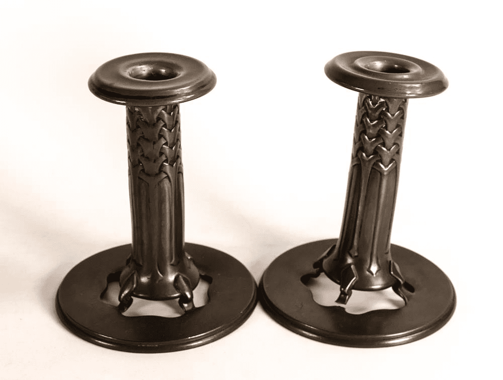 A pair of Pewter candlesticks, £220