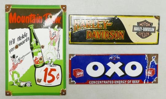 3 enamel advertising signs for brands Mountain Dew, Oxo and Harley-Davidson