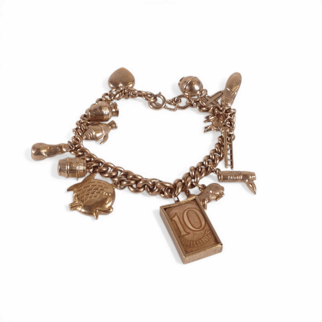 9ct gold charm bracelet, containing 14 9ct gold charms including one containing a ten shilling note, 34.5g.