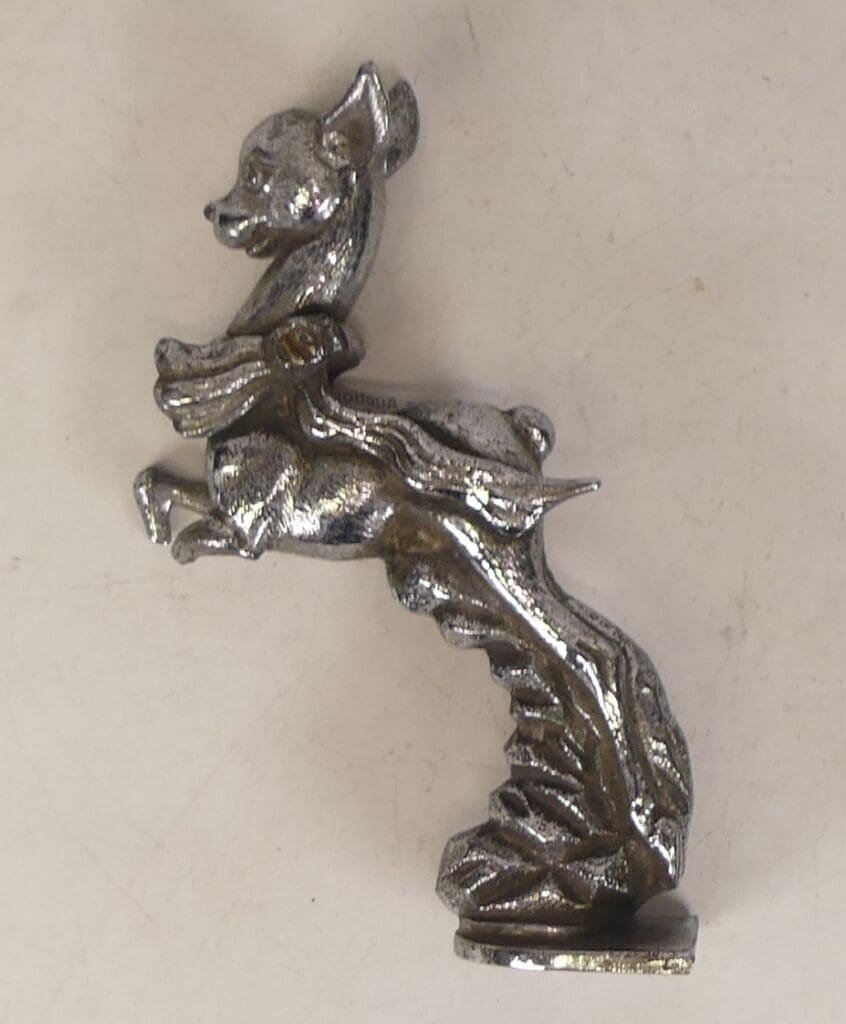 A Chrome Plated Babycham Car Mascot, £18 A 16.5cm Chrome-plated Babycham Car Mascot