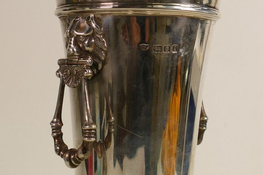 Lot-1549-Silver-two-handled-vase-2 A silver two-handled vase, hallmarked for London 1922 with lion head handles