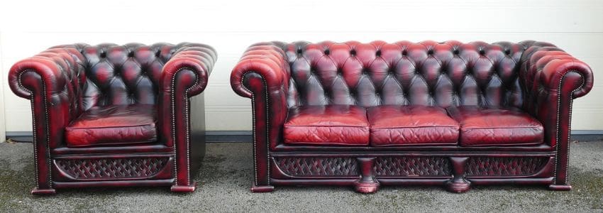 Lot-1234Ox-Blood-red-Chesterfield-settee-and-armchair an ox-blood red Chesterfield settee and armchair