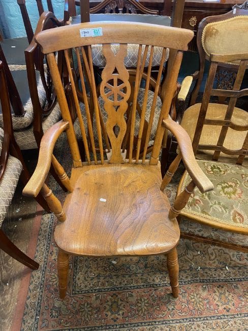 Lot-631-Pine-farmhouse-stick-back-carver-chair A pine farmhouse stick back carver chair