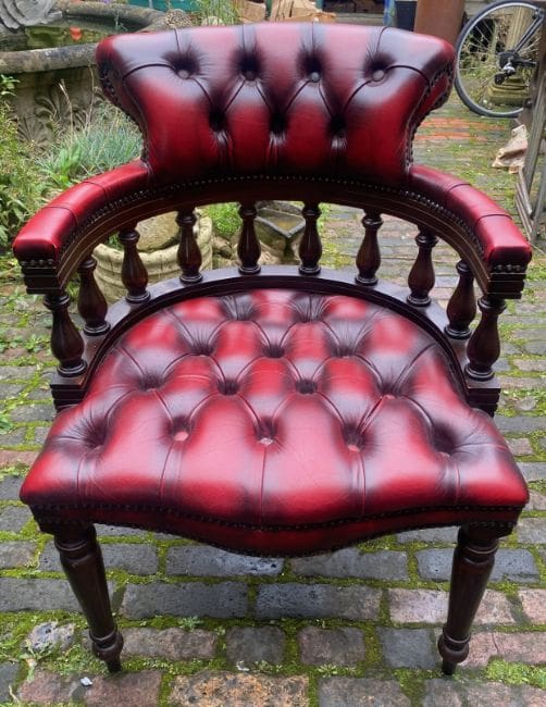 Lot-634-Oxblood-Red-Chesterfield-Captains-Chair An Oxblood Red Chesterfield Captains Chair