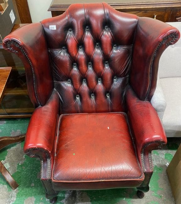 Lot-644-Oxblood-red-wingback-Chesterfield-Armchair An Oxblood red wingback Chesterfield Armchair