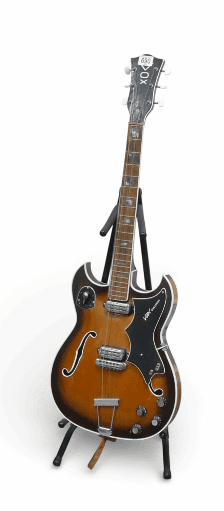 Vox Challenger, circa.1960's hollow-body electric guitar, by Crucianelli, with stand and spare guitar strings. (3)