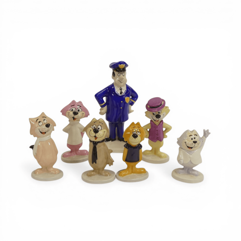 A set of Beswick characters from the Top Cat series comprising Officer Dibble, Top Cat, Benny, Brain, Choo-Choo, Spook and Fancy Fancy. (7)